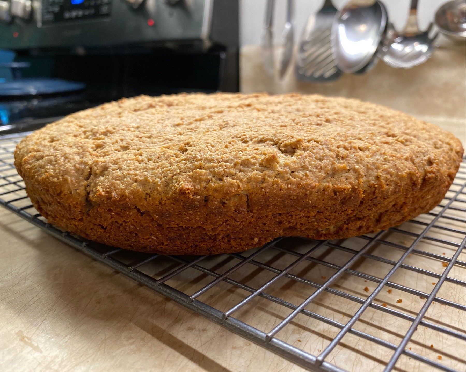 Brown bread cooling on rack.