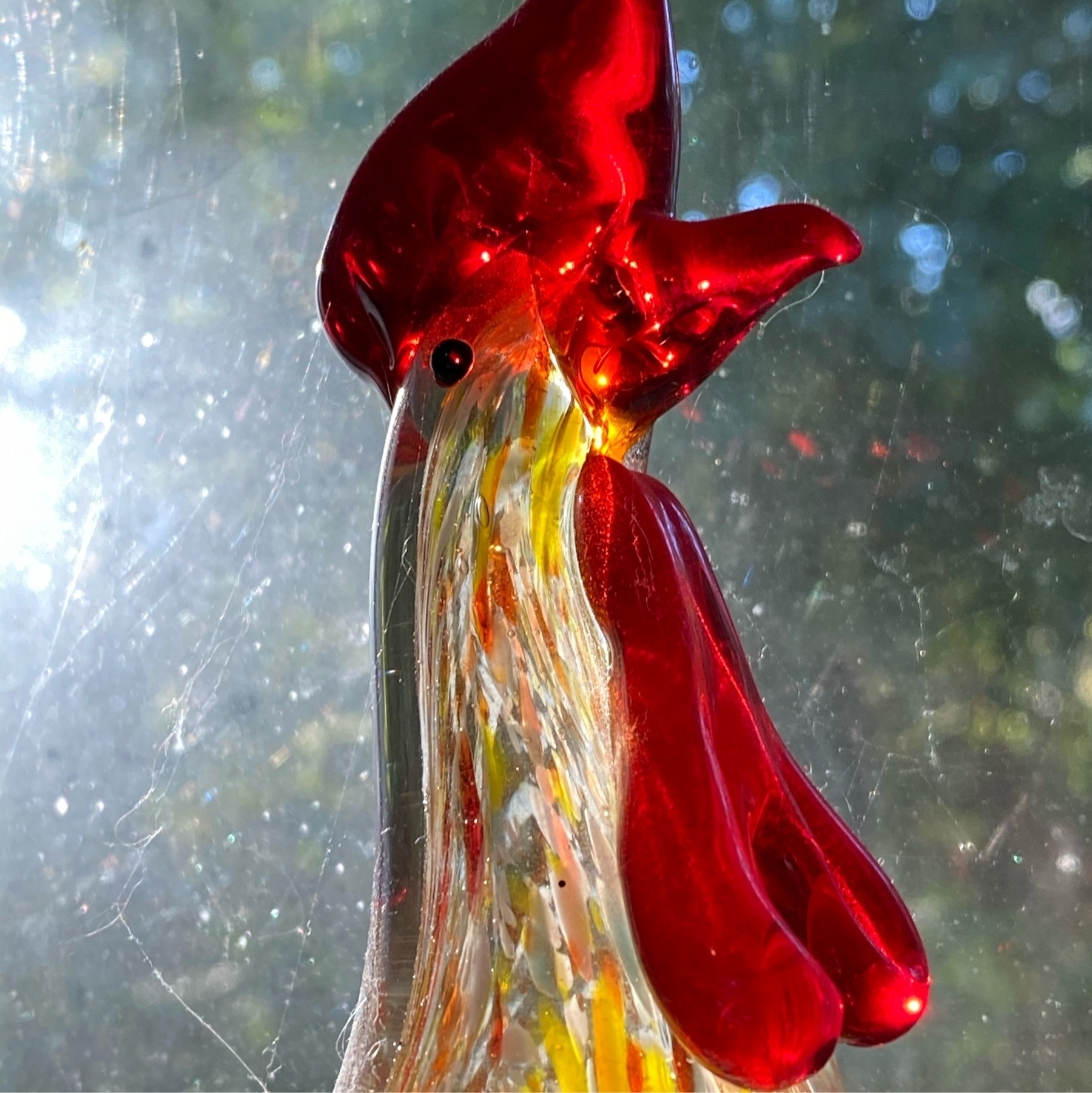 Head of rooster made of glass.