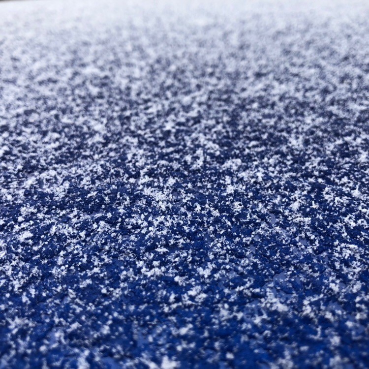Snow on car roof.