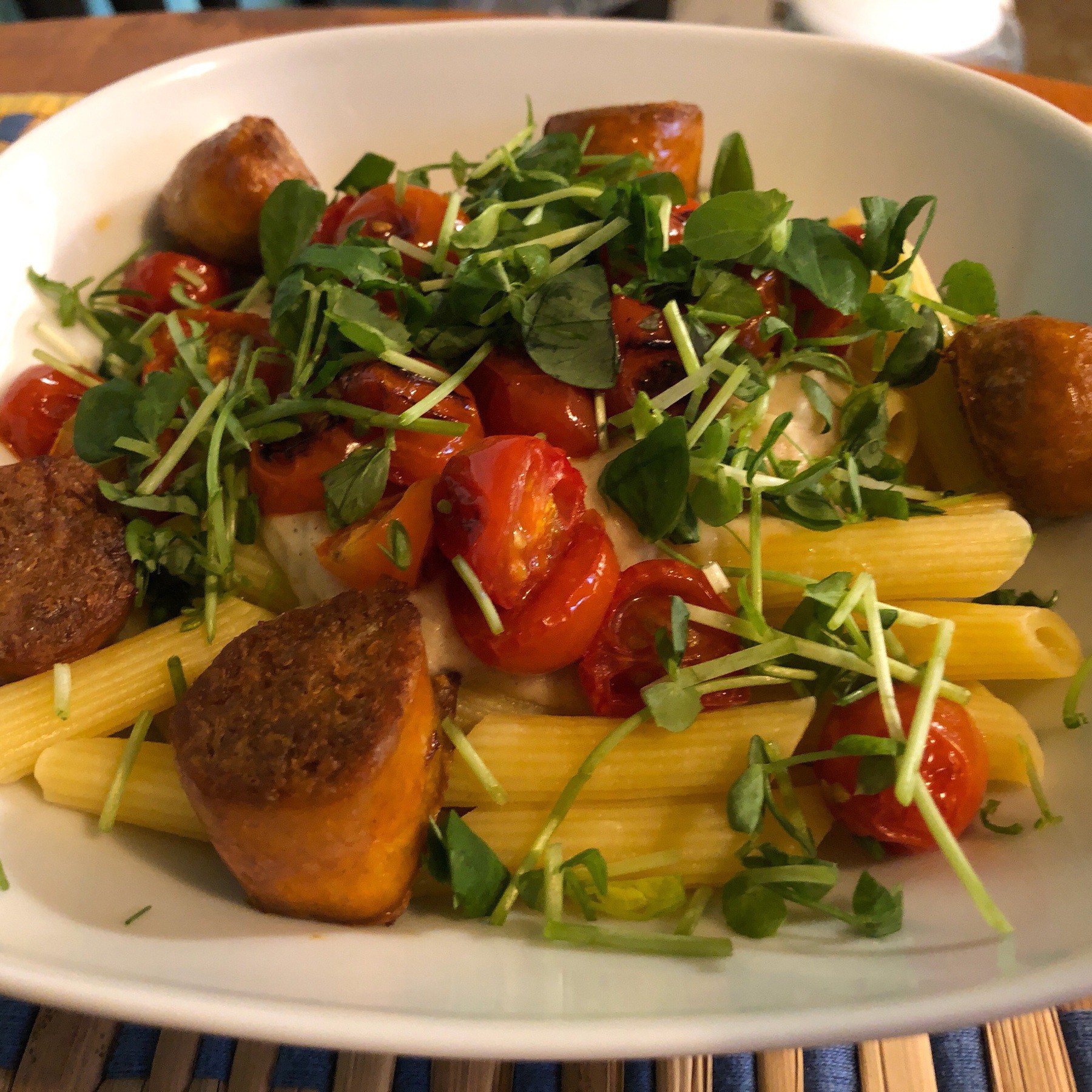 Pasta and veggie sausages in bowl.