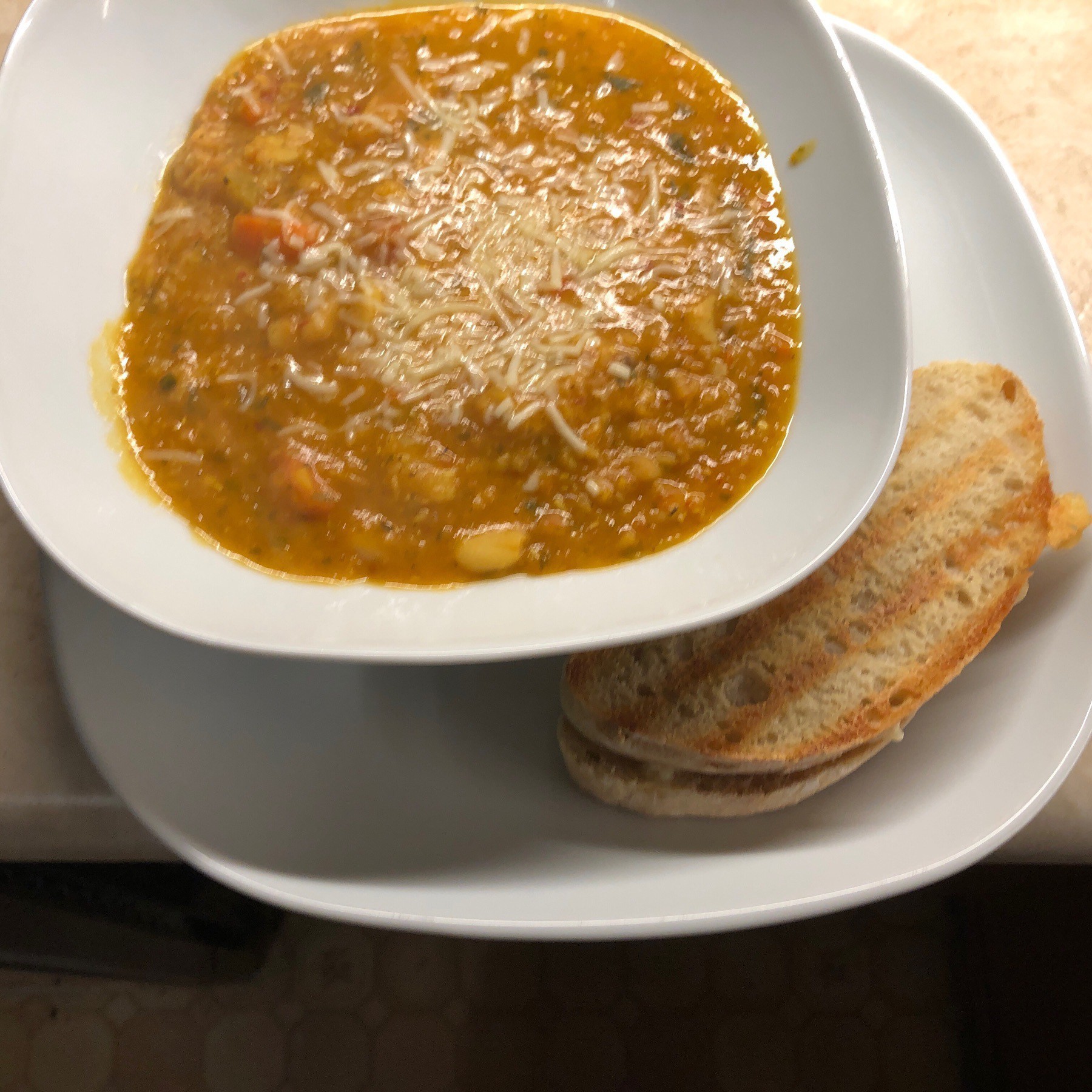 Bowl of soup and grilled cheese.