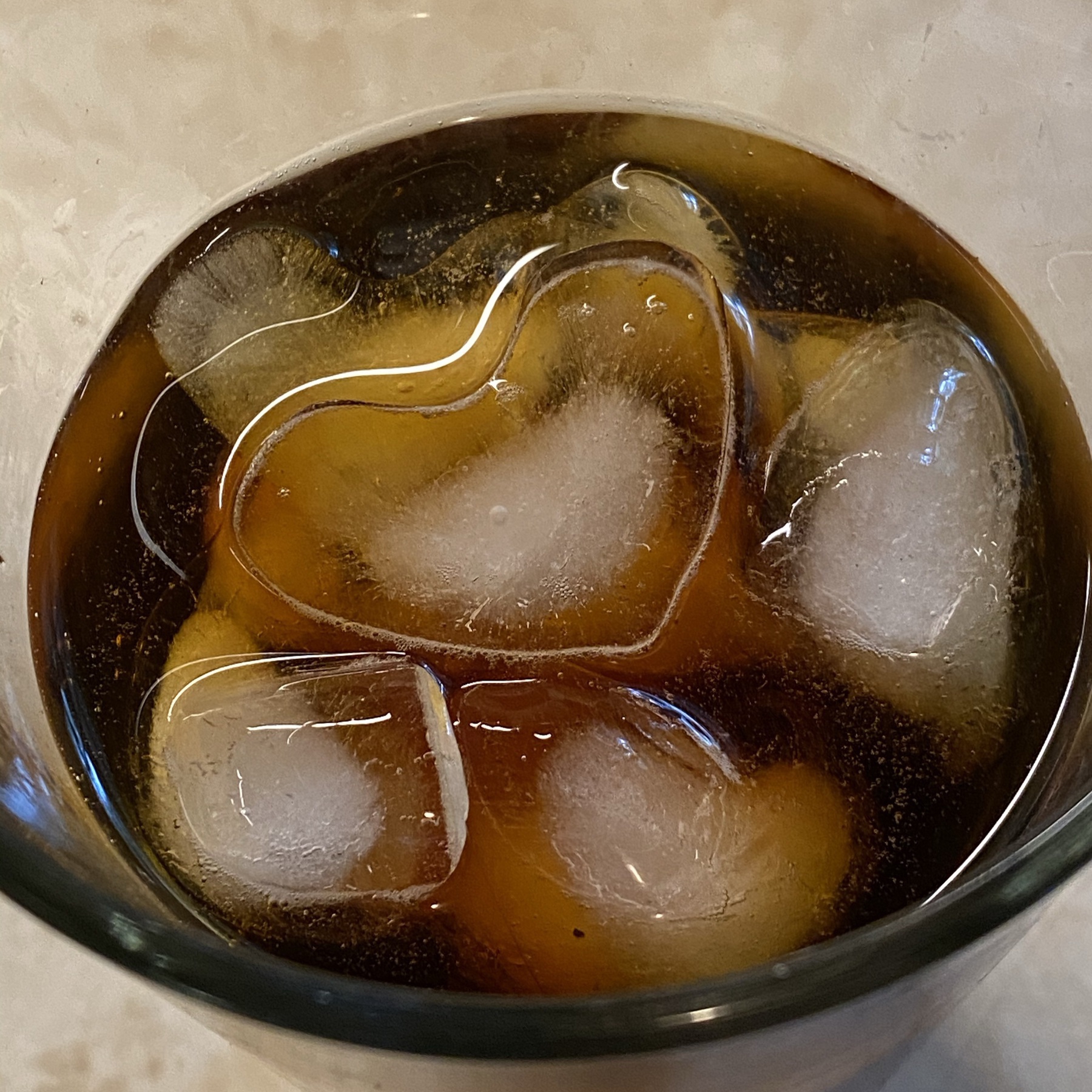 Cold brewed coffee in glass with ice cubes.