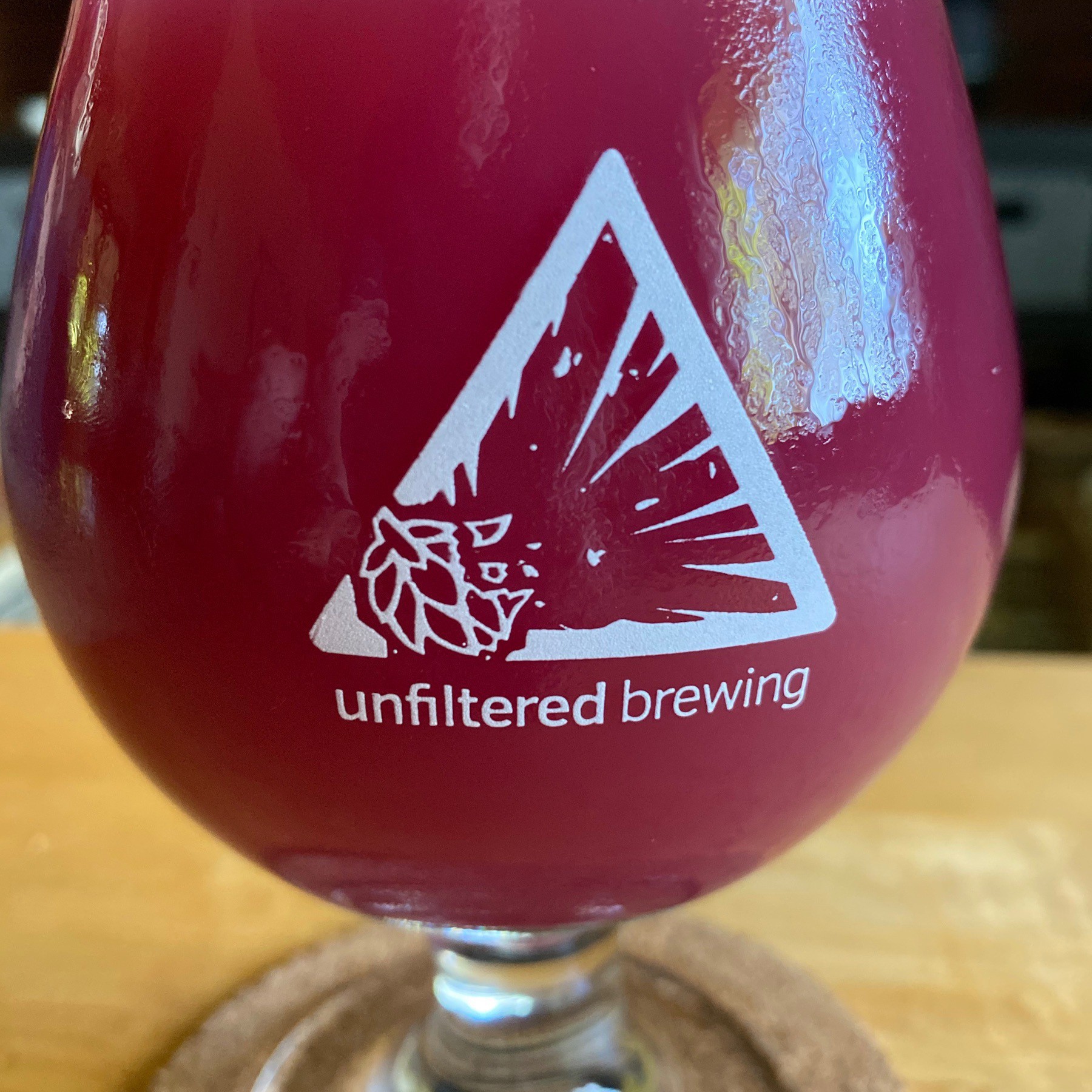 Blueberry beer in glass.