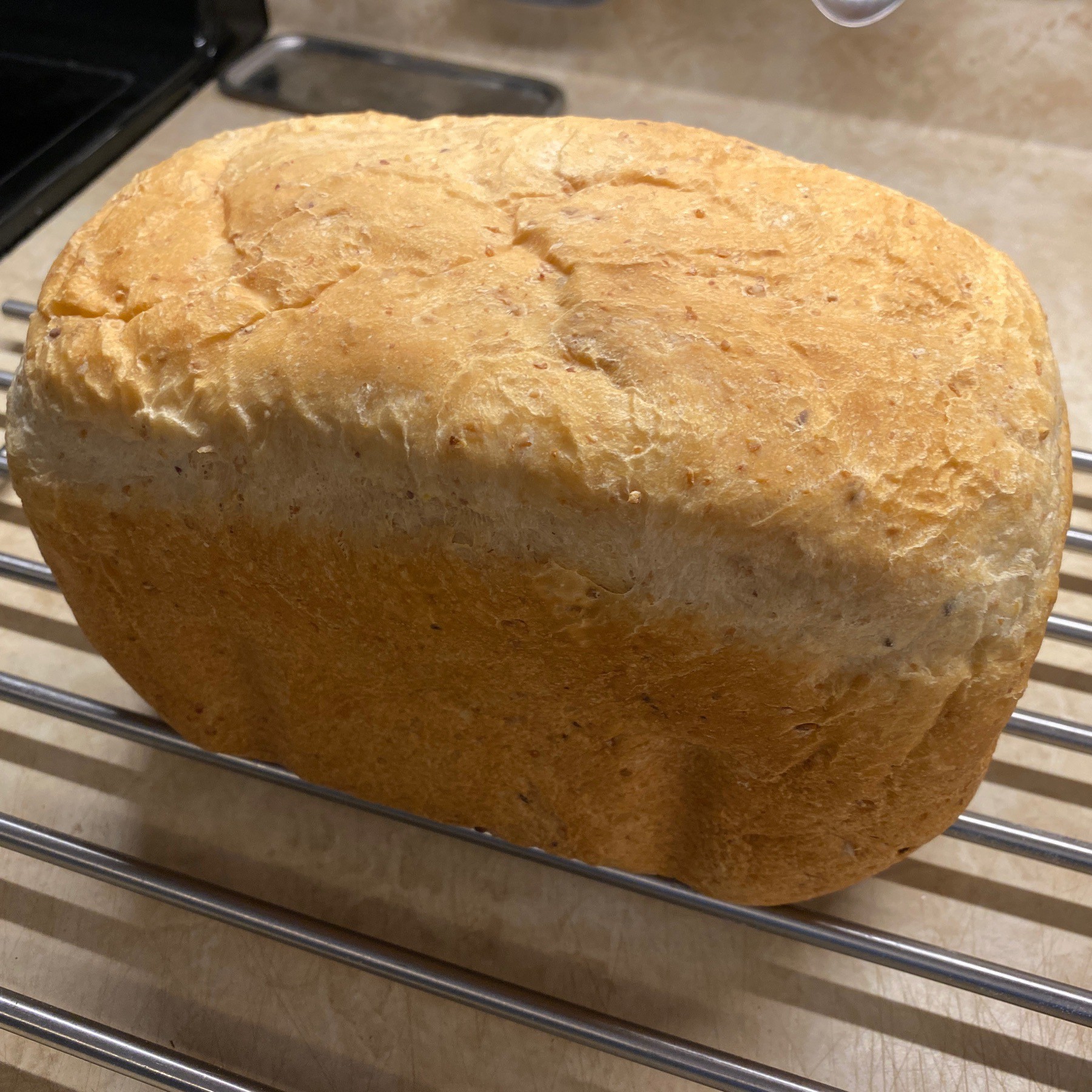 loaf of bread cooling on rack