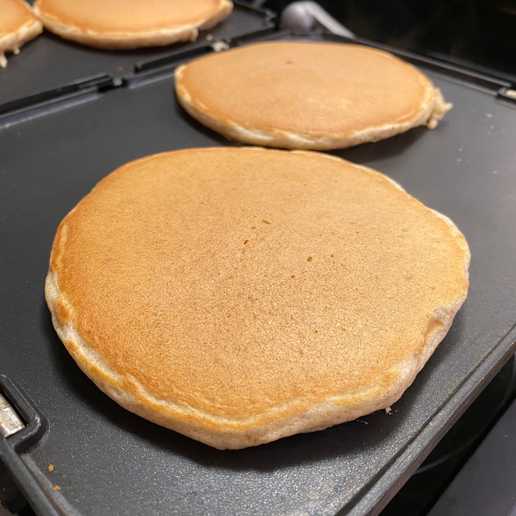 Pancakes on griddle.