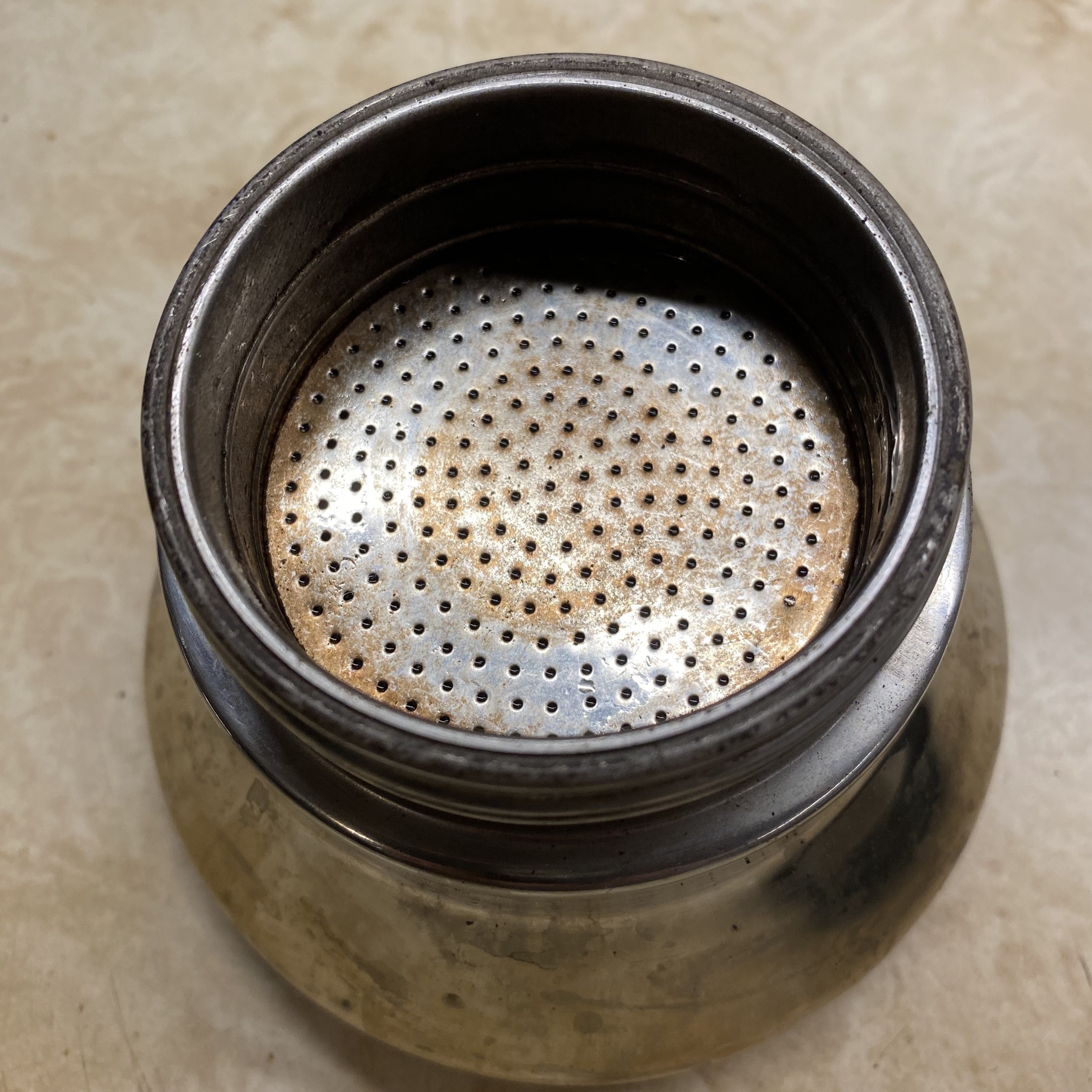Metal coffee filter.