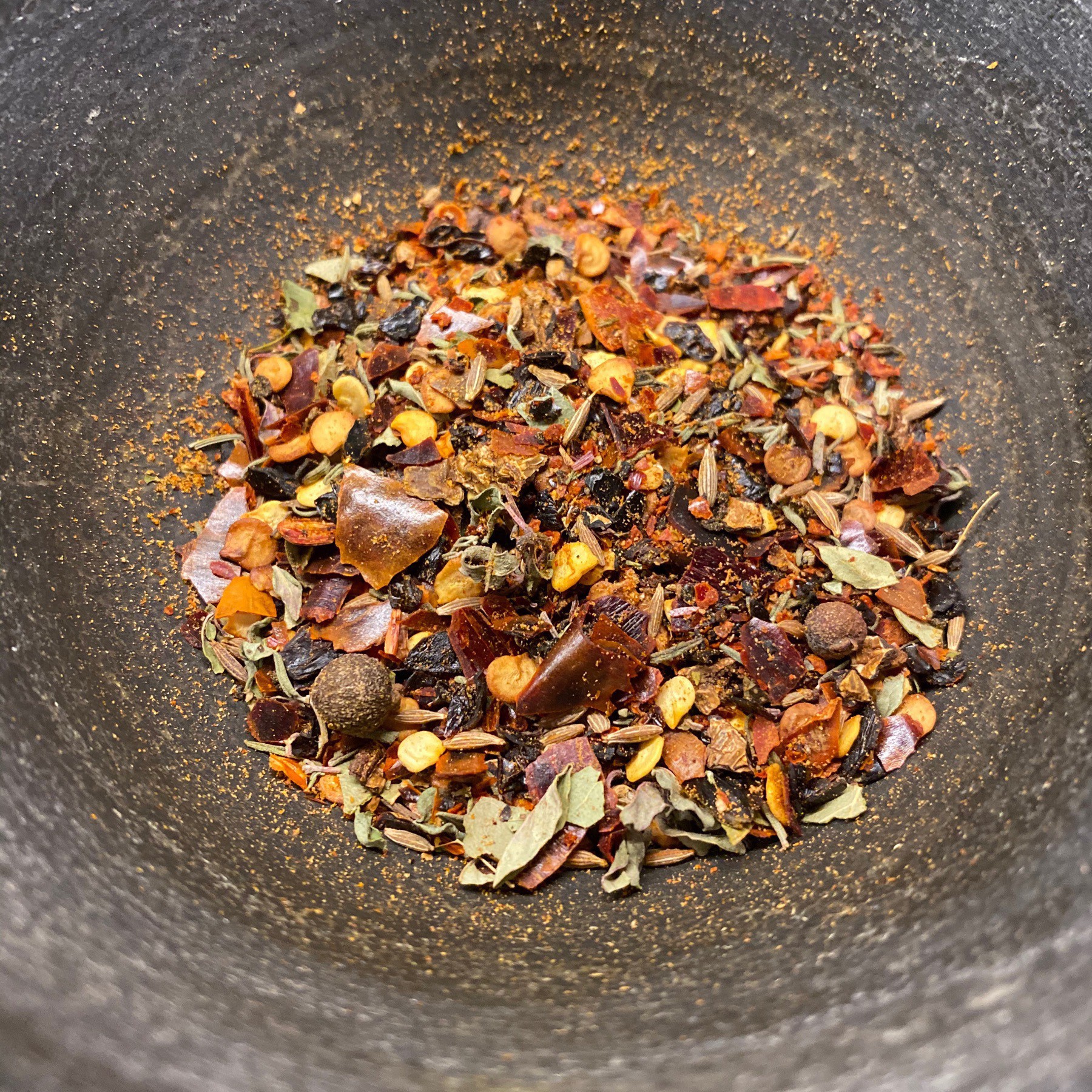 Chili spices in mortar and pestle.